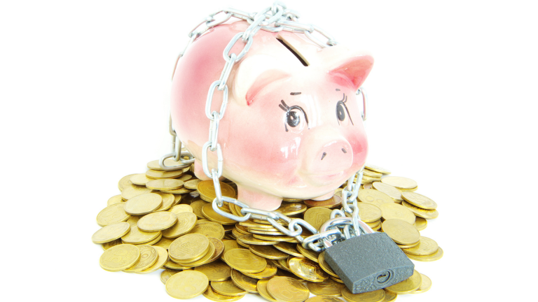 pink piggy bank secured with chain and padlock